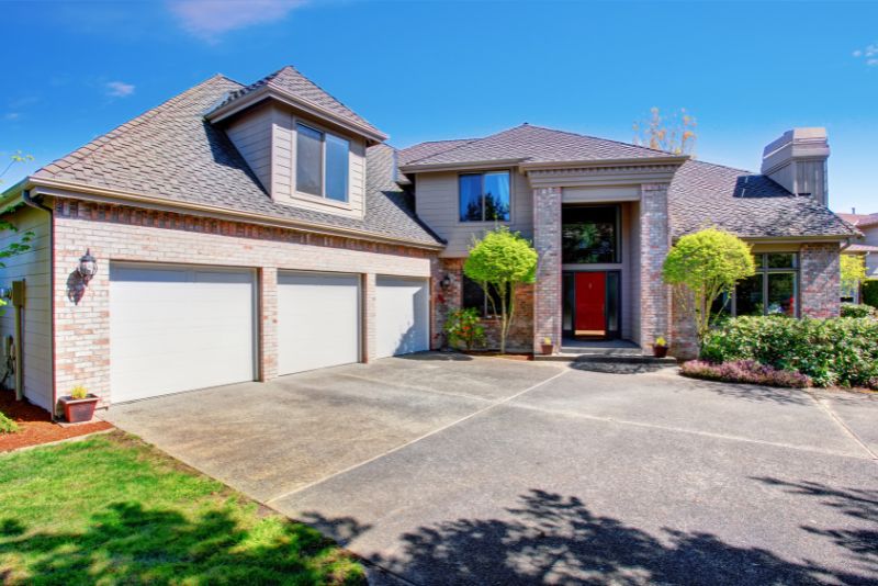 Modern family home with a newly poured concrete driveway