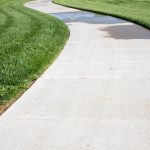 Finished concrete footpath alongside a residential property