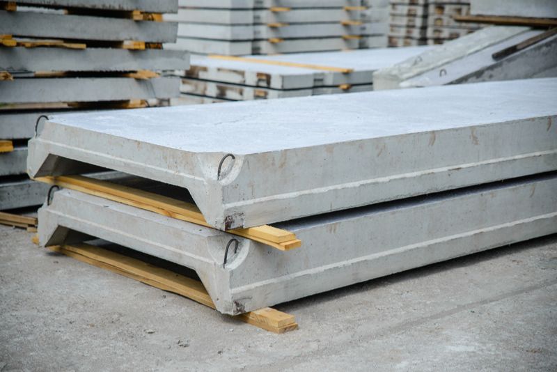 Stacked precast concrete slabs at a supply yard