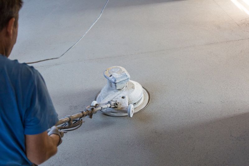 worker polishing concrete floor